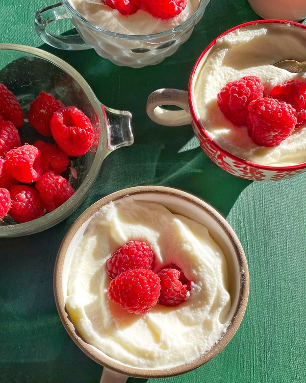 White Chocolate Mousse combines fresh whipping cream with melted white chocolate for a sweet treat! Find the recipe on Shutterbean.com