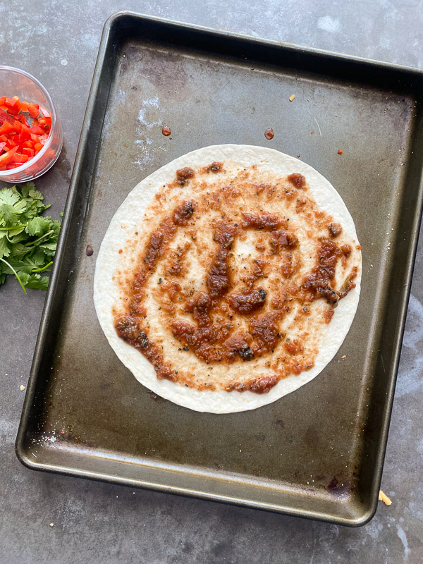 Mexican Pizza is a fun way to shake up dinner. It's like an open-faced quesadilla. Find instructions on Shutterbean.com