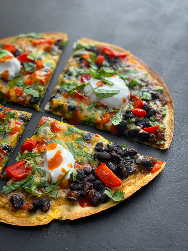 Mexican Pizza is a fun way to shake up dinner. It's like an open-faced quesadilla. Find instructions on Shutterbean.com