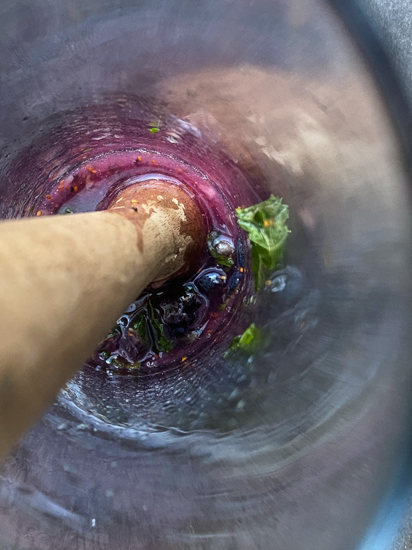 Blueberry Mojito is a refreshing cocktail! Muddled mint and blueberries add color to your life! Find the recipe on Shutterbean.com