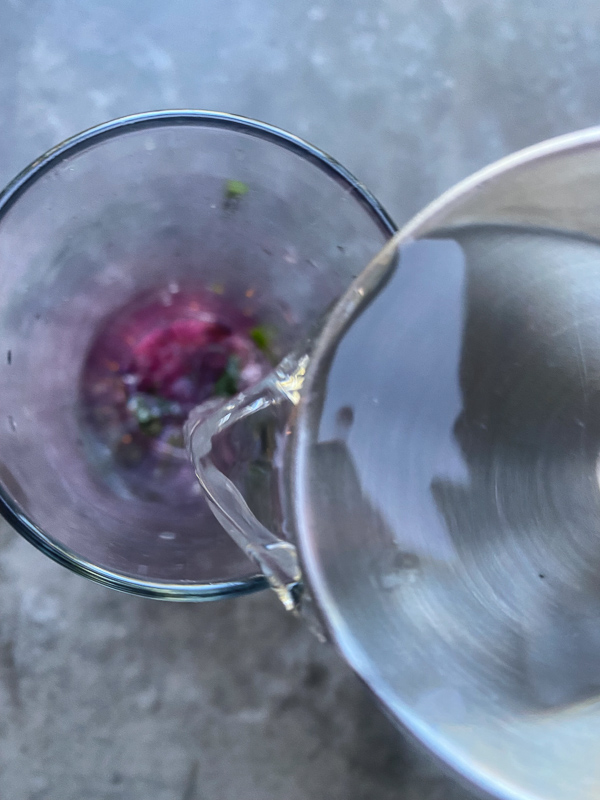 Blueberry Mojito is a refreshing cocktail! Muddled mint and blueberries add color to your life! Find the recipe on Shutterbean.com