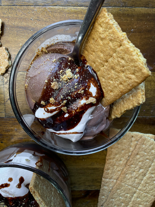 S'mores Sundaes are a combination of chocolate ice cream, marshmallow fluff and hot fudge! Don't forget the graham crackers. Find the recipe on Shutterbean! 