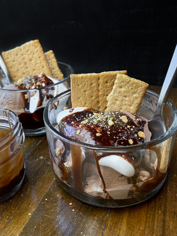 S'mores Sundaes are a combination of chocolate ice cream, marshmallow fluff and hot fudge! Don't forget the graham crackers. Find the recipe on Shutterbean! 