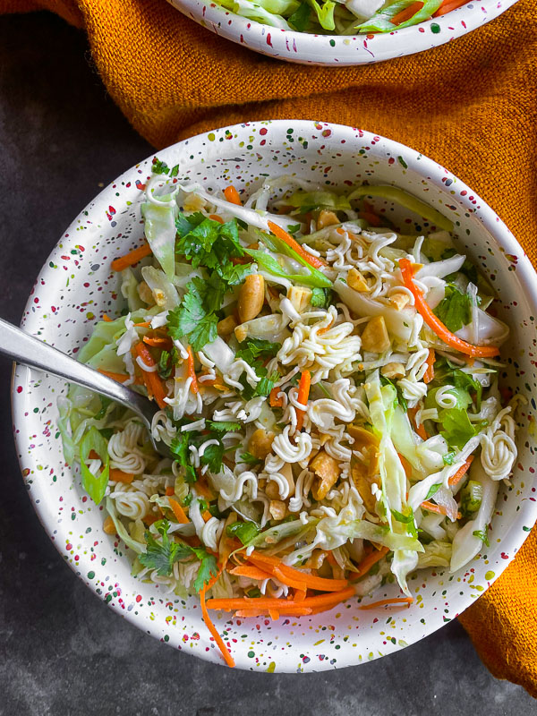 Crunchy Ramen and Cabbage Salad is a great way to get your vegetables in! Find the recipe on Shutterbean.com