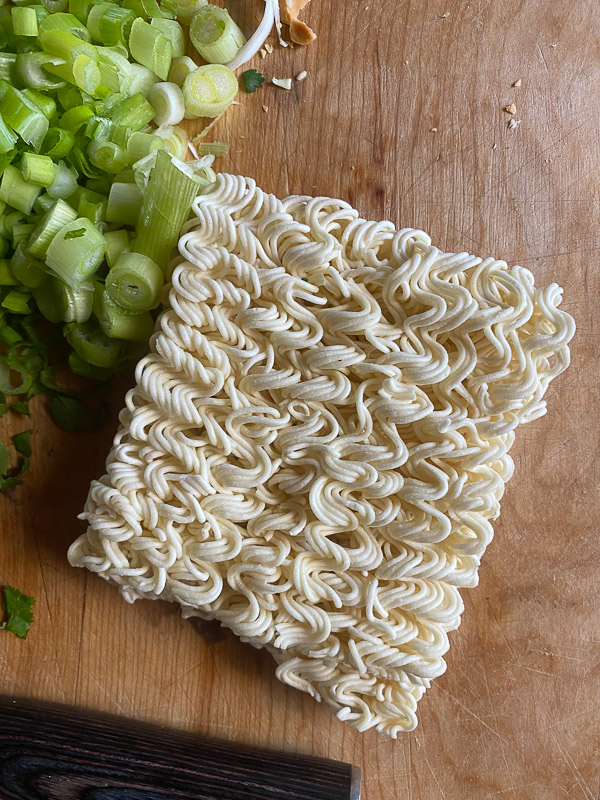 Crunchy Ramen and Cabbage Salad is a great way to get your vegetables in! Find the recipe on Shutterbean.com