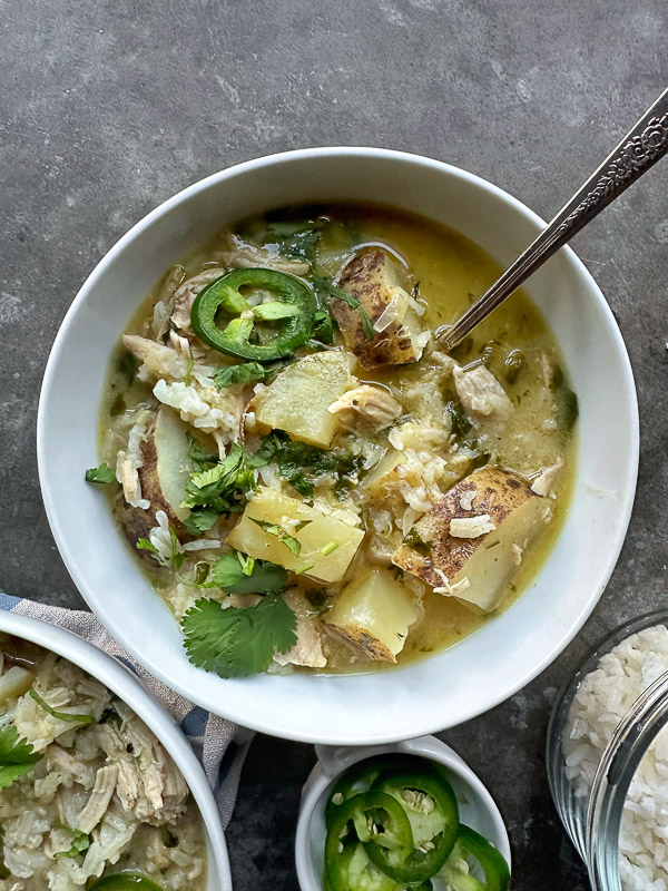 Curry Coconut Chicken Soup is packed with flavor! Tracy from Shutterbean shows you how to make this weeknight curry! 