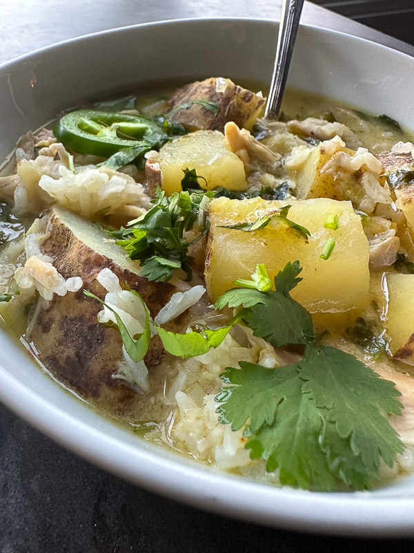 Curry Coconut Chicken Soup is packed with flavor! Tracy from Shutterbean shows you how to make this weeknight curry! 