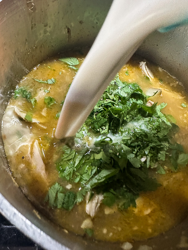 Curry Coconut Chicken Soup is packed with flavor! Tracy from Shutterbean shows you how to make this weeknight curry! 