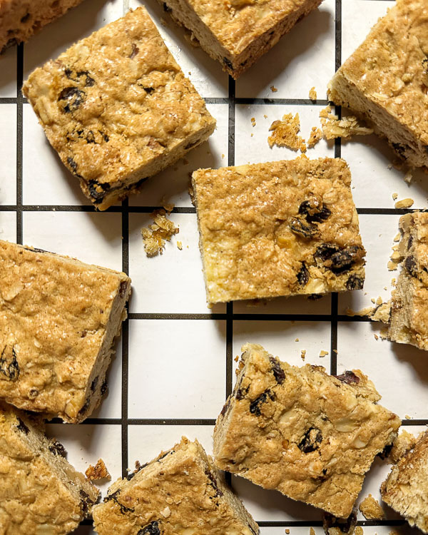 Oatmeal Raisin Bars taste like a cross between a blondie and an oatmeal raisin cookie. Find the recipe for this treat on Shutterbean.com! 