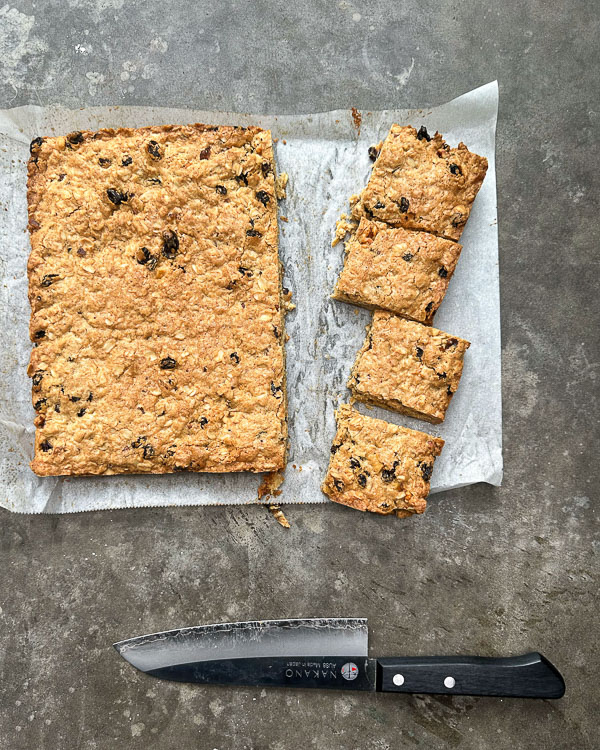 Oatmeal Raisin Bars taste like a cross between a blondie and an oatmeal raisin cookie. Find the recipe for this treat on Shutterbean.com! 