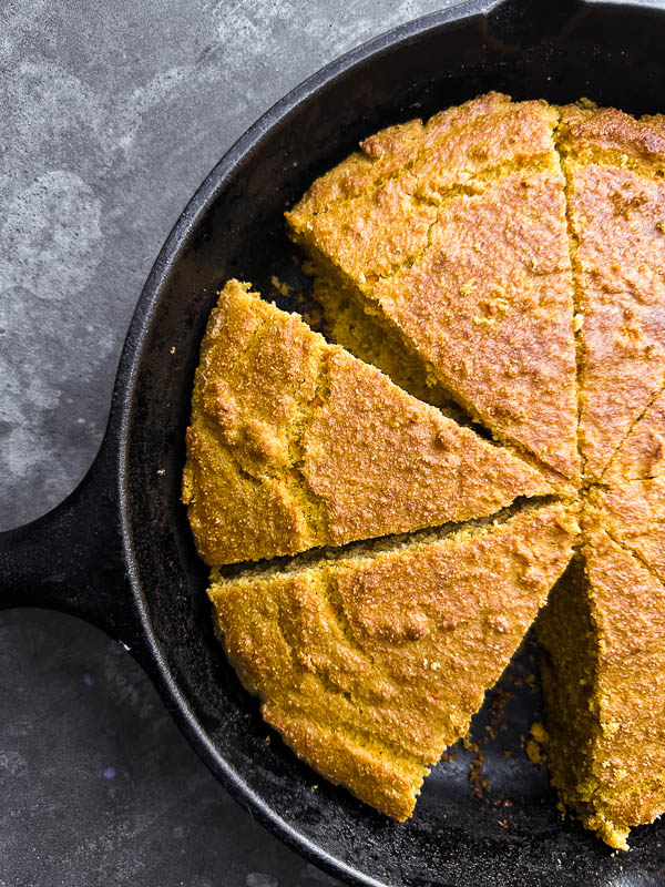 Sweet Potato Cornbread is slightly sweet and perfect paired with honey butter. Find the recipe on Shutterbean.com