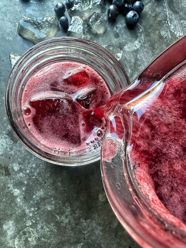 Blueberry Limeade is a refreshing drink that's great mixed with sparkling water or spirits! Find the recipe on Shutterbean.com