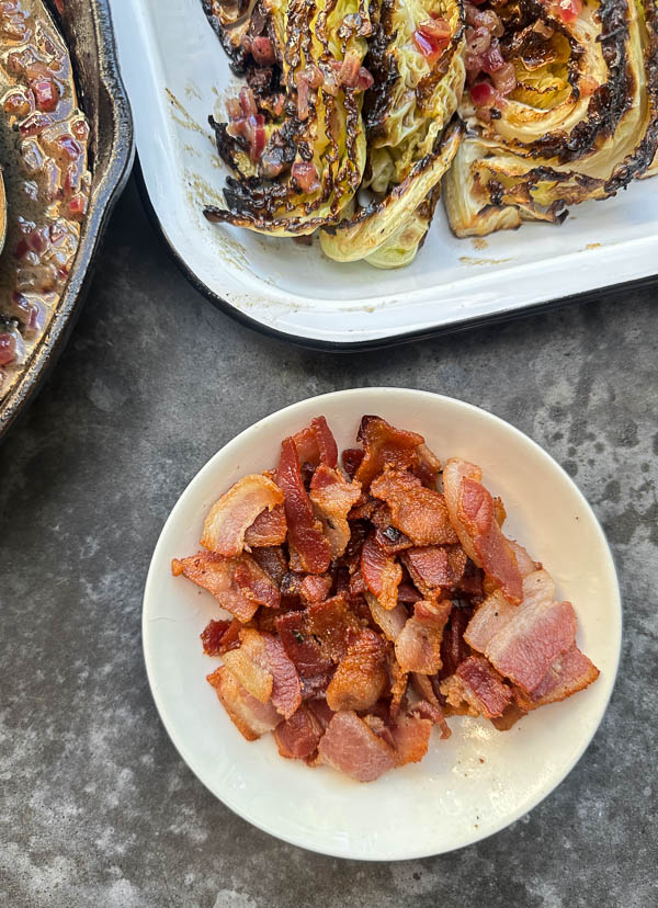 Try this Maple Bacon Cabbage recipe! Roasted cabbage wedges with crispy bacon and a homemade maple Dijon dressing. Easy, flavorful, gluten-free side dish for fall dinners, Thanksgiving, or meal prep. #vegetableside #cabbagerecipes #shutterbean