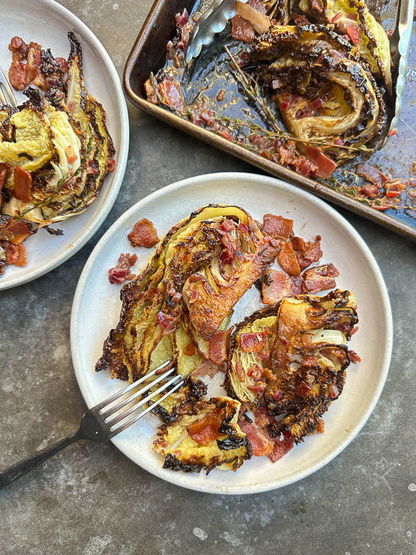 Try this Maple Bacon Cabbage recipe! Roasted cabbage wedges with crispy bacon and a homemade maple Dijon dressing. Easy, flavorful, gluten-free side dish for fall dinners, Thanksgiving, or meal prep. #vegetableside #cabbagerecipes #shutterbean