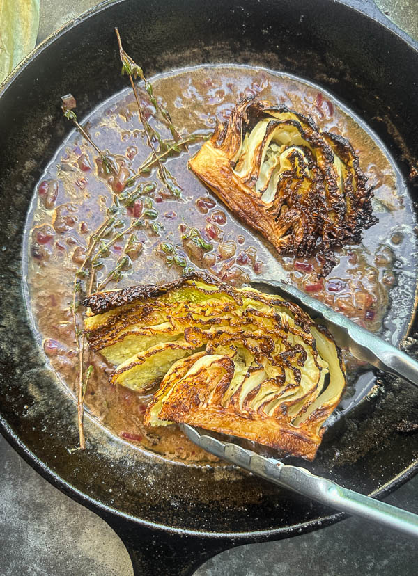 Try this Maple Bacon Cabbage recipe! Roasted cabbage wedges with crispy bacon and a homemade maple Dijon dressing. Easy, flavorful, gluten-free side dish for fall dinners, Thanksgiving, or meal prep. #vegetableside #cabbagerecipes #shutterbean